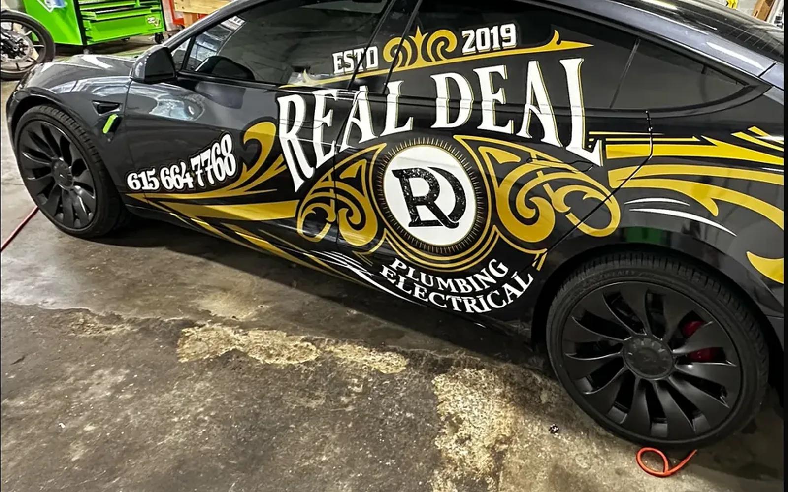 Real Deal Plumbing Electrical Tesla after wrap